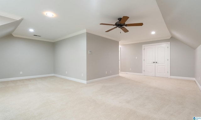 bonus room with light carpet, ceiling fan, and lofted ceiling