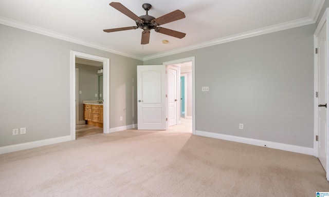 unfurnished bedroom with ensuite bathroom, ceiling fan, crown molding, and light colored carpet