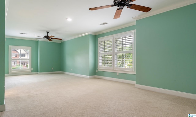 empty room with ceiling fan, ornamental molding, and light carpet