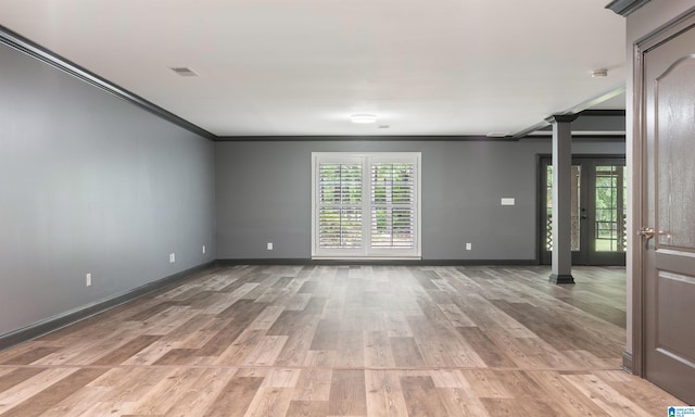 unfurnished room with light hardwood / wood-style flooring and ornamental molding