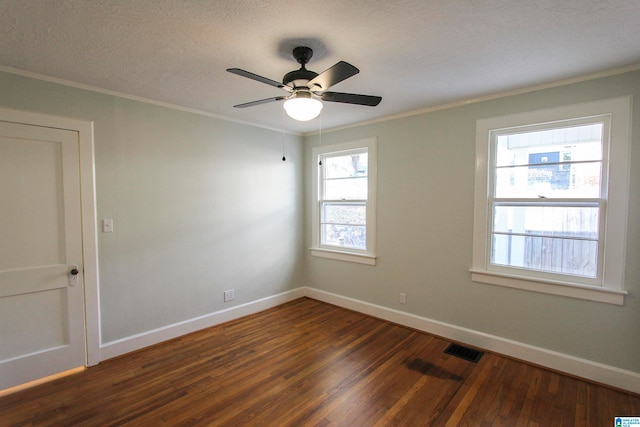 spare room featuring crown molding, dark hardwood / wood-style flooring, ceiling fan, and a textured ceiling