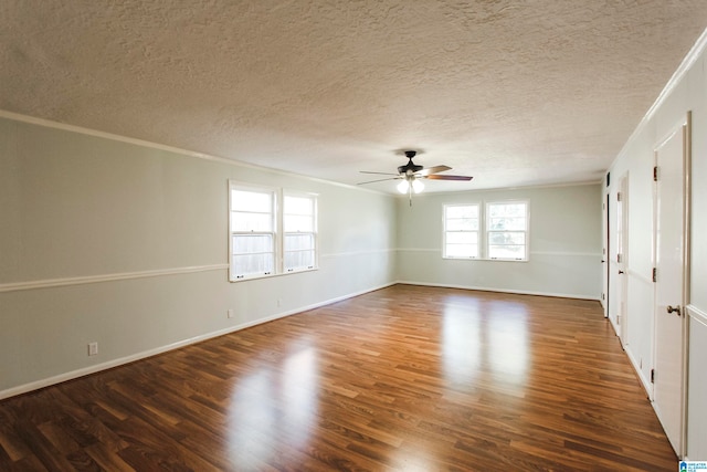 spare room featuring a textured ceiling, ceiling fan, dark hardwood / wood-style floors, and ornamental molding