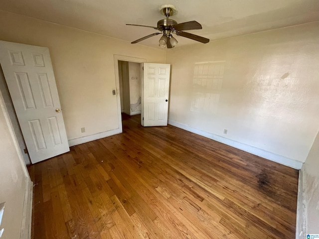 unfurnished bedroom featuring hardwood / wood-style floors and ceiling fan