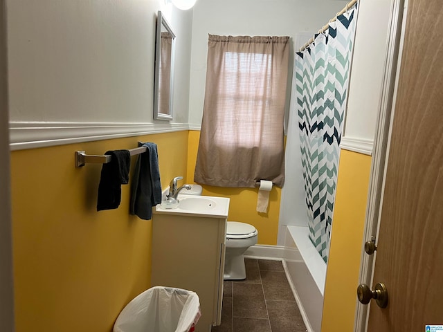 full bathroom featuring vanity, tile patterned flooring, toilet, and shower / bath combo with shower curtain