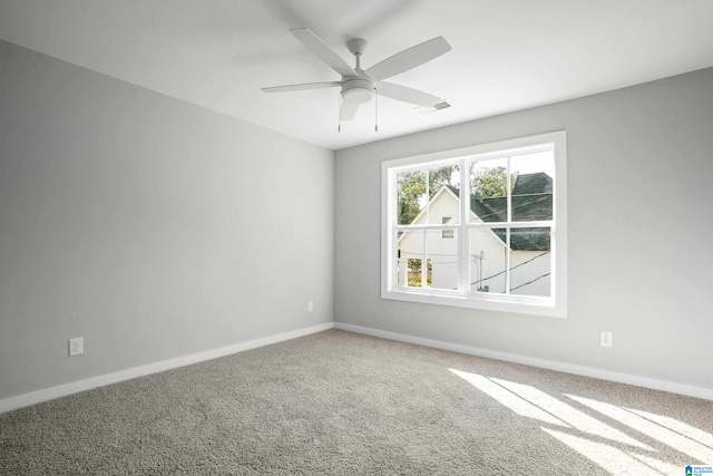 unfurnished room with carpet flooring and ceiling fan