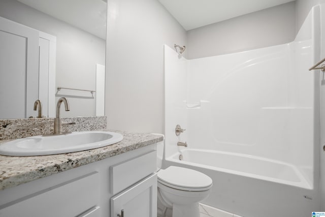 full bathroom featuring tile patterned floors, vanity, toilet, and shower / washtub combination