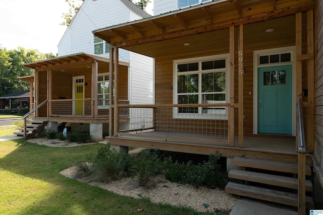 doorway to property with covered porch