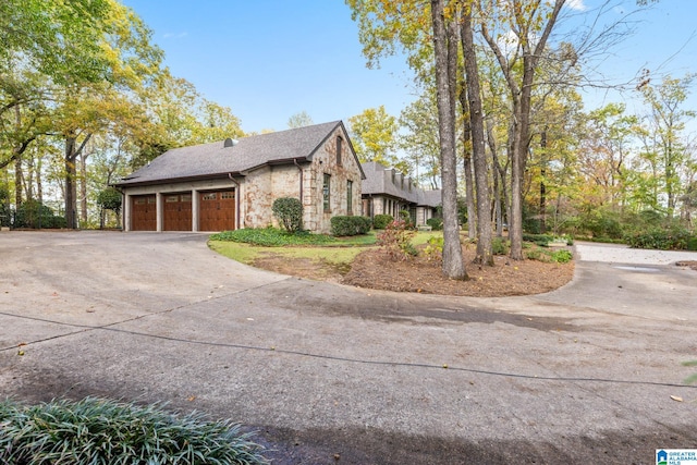 view of side of property featuring a garage