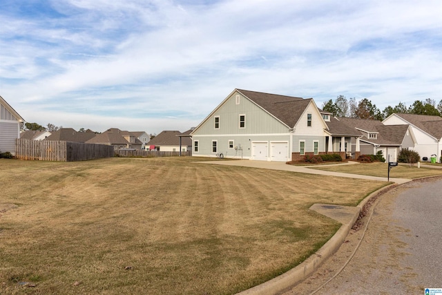 exterior space with a front yard and a garage