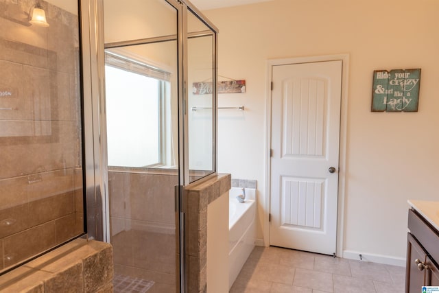 bathroom with shower with separate bathtub, vanity, and tile patterned floors