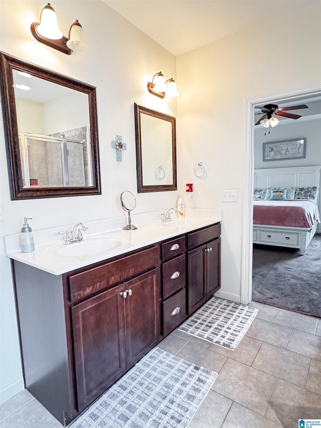 bathroom featuring ceiling fan, tile patterned flooring, vanity, and a shower with shower door