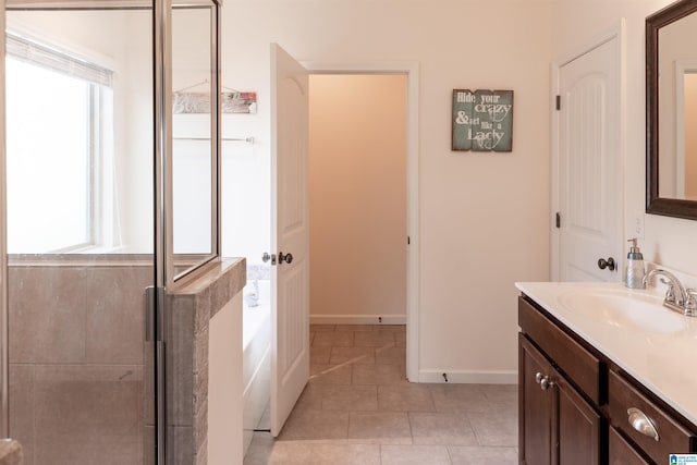 bathroom featuring tile patterned floors, vanity, and independent shower and bath