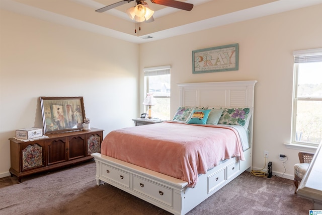 bedroom featuring carpet flooring, multiple windows, and ceiling fan