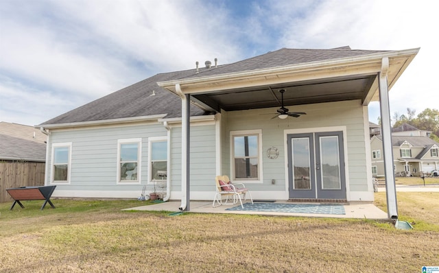 back of house with a lawn, ceiling fan, and a patio