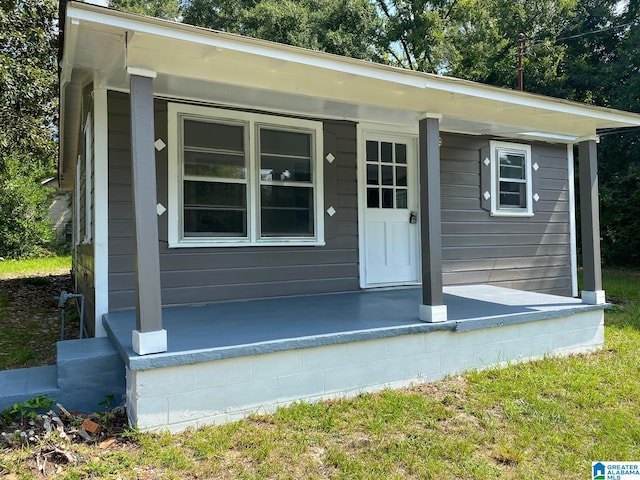 doorway to property featuring covered porch