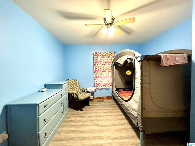 bedroom with ceiling fan and light wood-type flooring