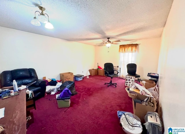 interior space featuring ceiling fan, carpet, and a textured ceiling