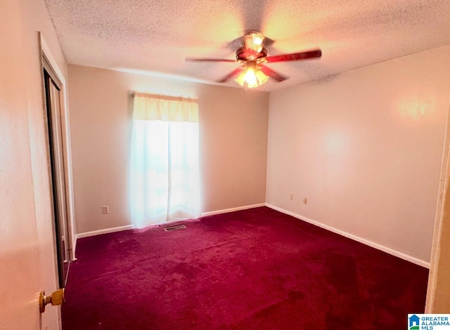 unfurnished room with carpet flooring, a textured ceiling, and ceiling fan