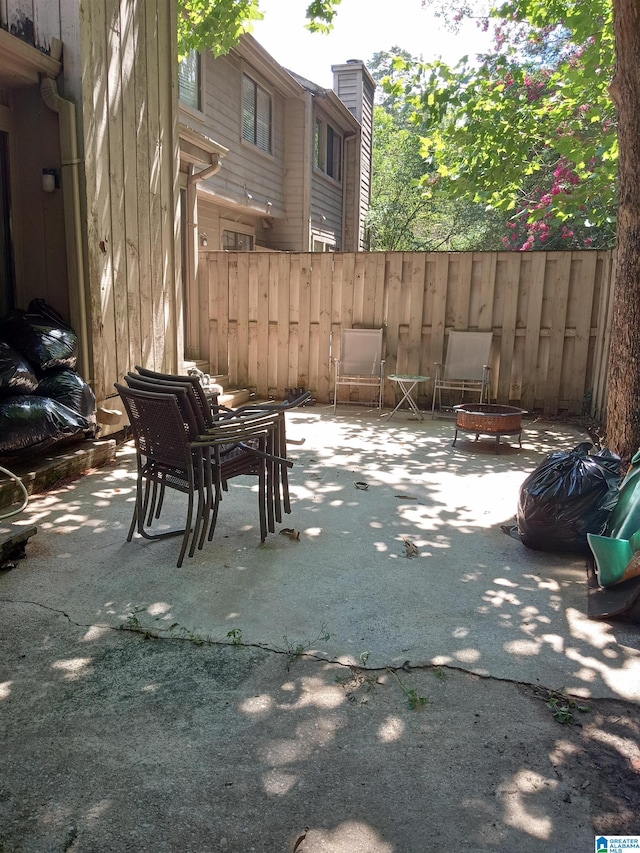 view of patio / terrace featuring a fire pit