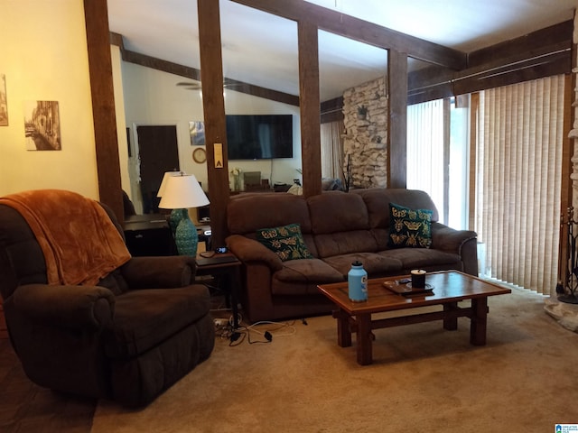 carpeted living room featuring vaulted ceiling