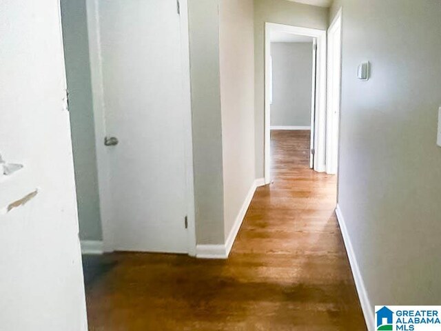 corridor featuring hardwood / wood-style floors