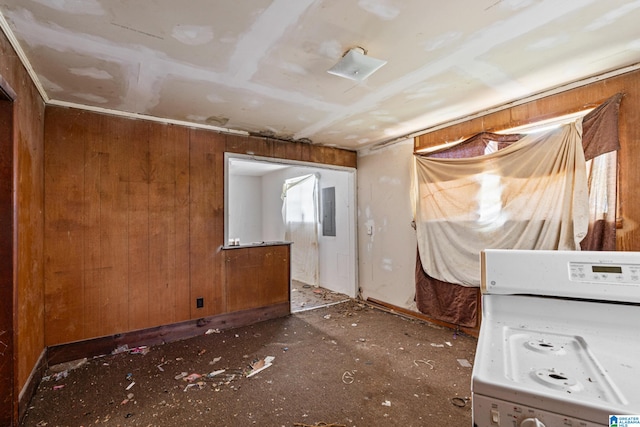 miscellaneous room with wood walls, washer / dryer, and electric panel