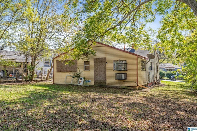 rear view of house with a lawn