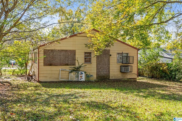 view of outbuilding featuring a yard