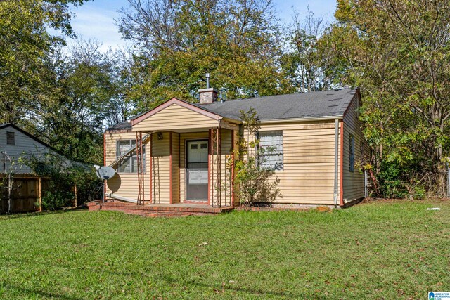 bungalow-style house with a front yard