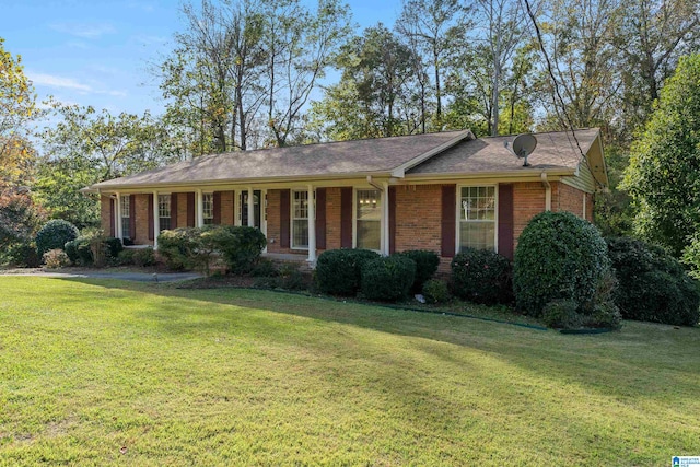 ranch-style home with a front lawn