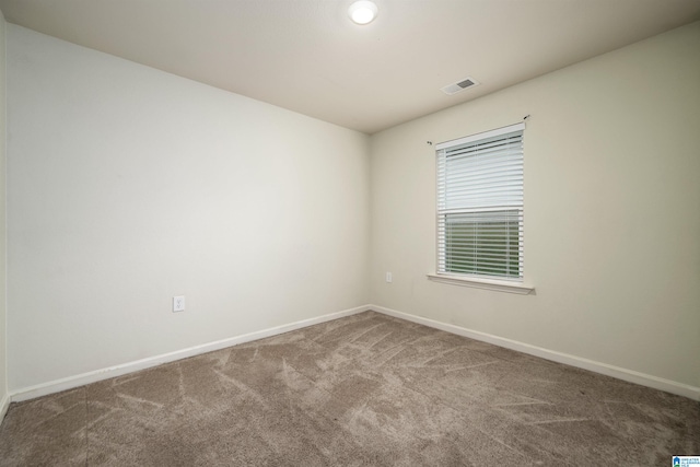 unfurnished room with carpet floors