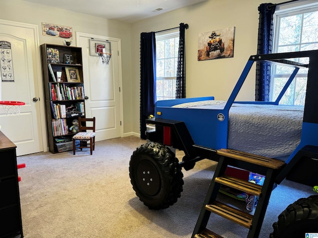 playroom with plenty of natural light and carpet