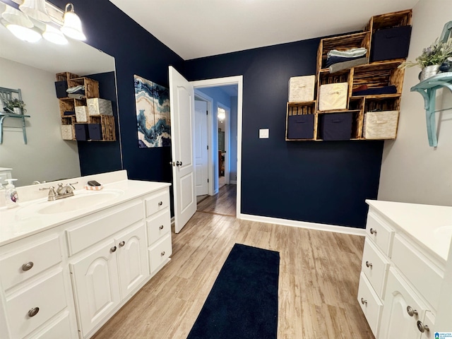 bathroom featuring hardwood / wood-style flooring and vanity