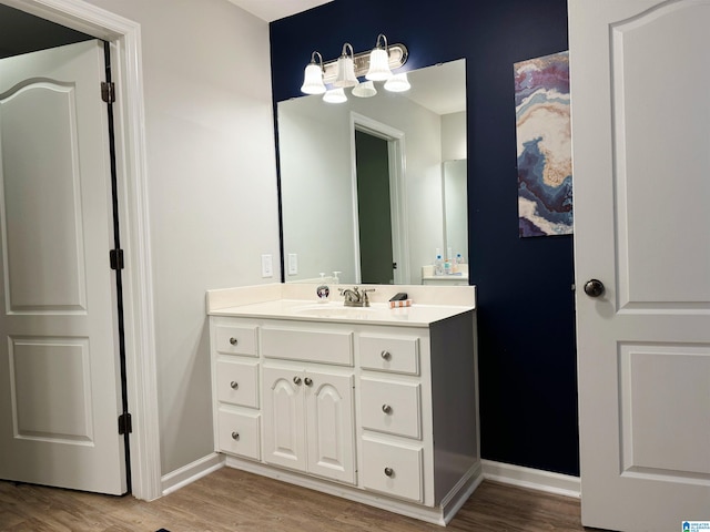 bathroom featuring hardwood / wood-style floors and vanity