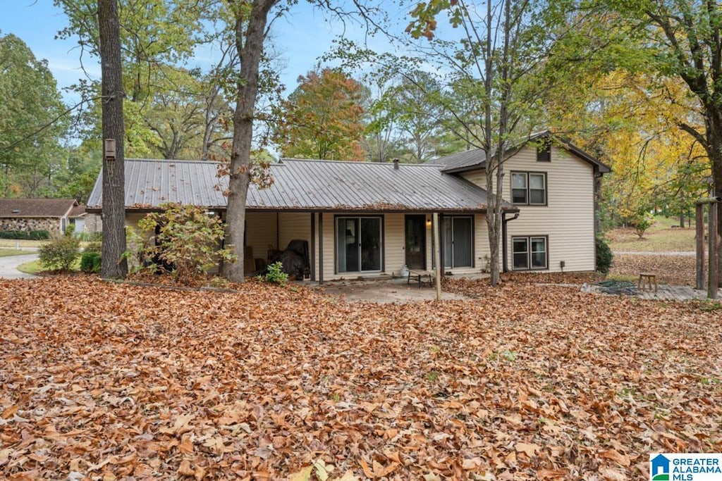 rear view of house featuring a patio area