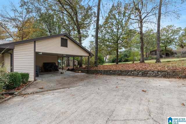 view of property exterior with a carport