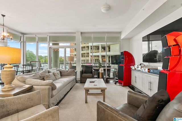 carpeted living room featuring a wall of windows and an inviting chandelier