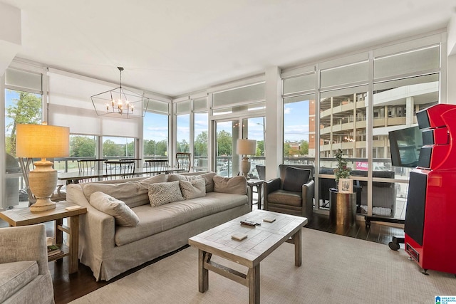 sunroom / solarium featuring a notable chandelier and a healthy amount of sunlight