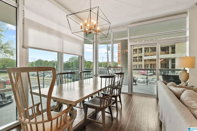 sunroom / solarium with an inviting chandelier