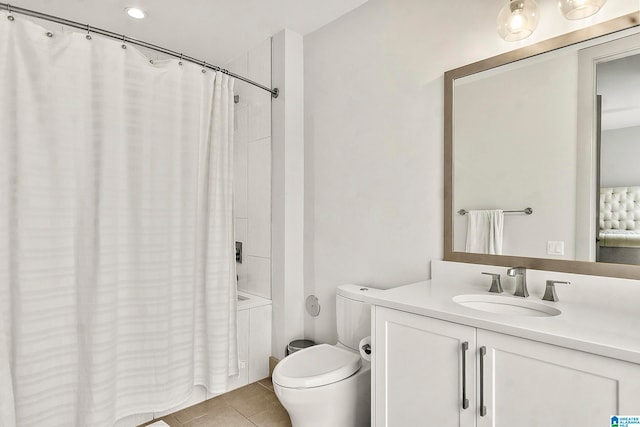 full bathroom featuring tile patterned floors, shower / bathtub combination with curtain, vanity, and toilet