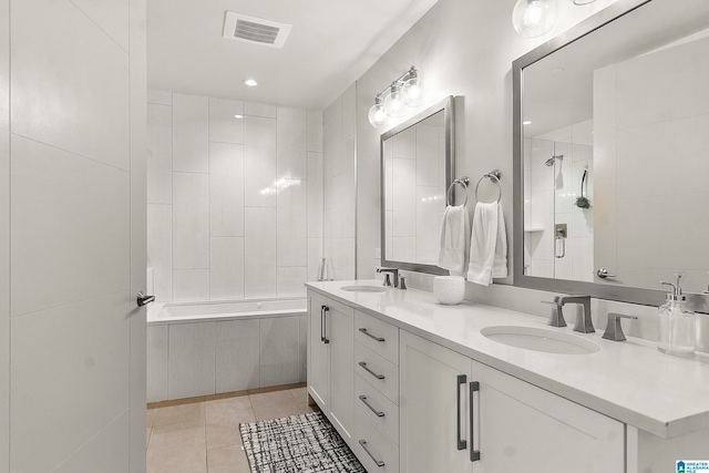 bathroom featuring tile patterned flooring and vanity