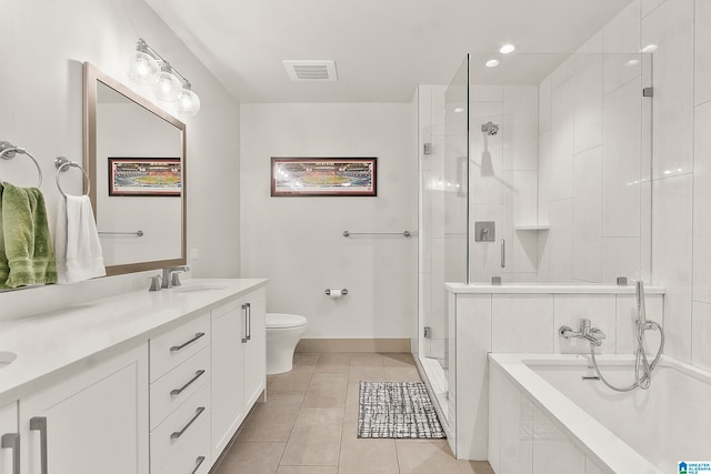 full bathroom with tile patterned floors, separate shower and tub, vanity, and toilet