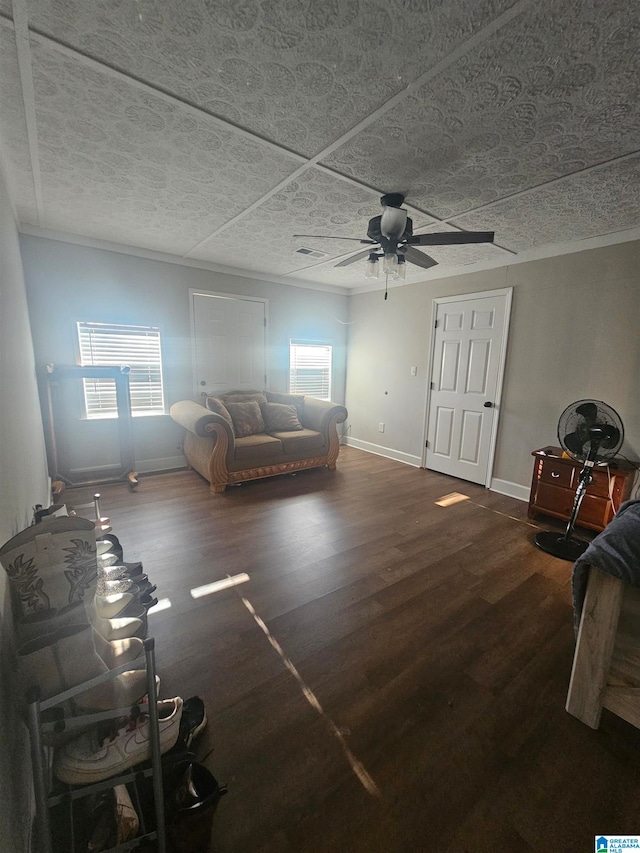 unfurnished living room featuring a textured ceiling, a wealth of natural light, ceiling fan, and dark hardwood / wood-style floors