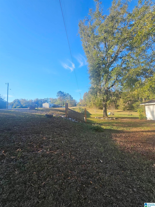 view of yard with a mountain view and a rural view