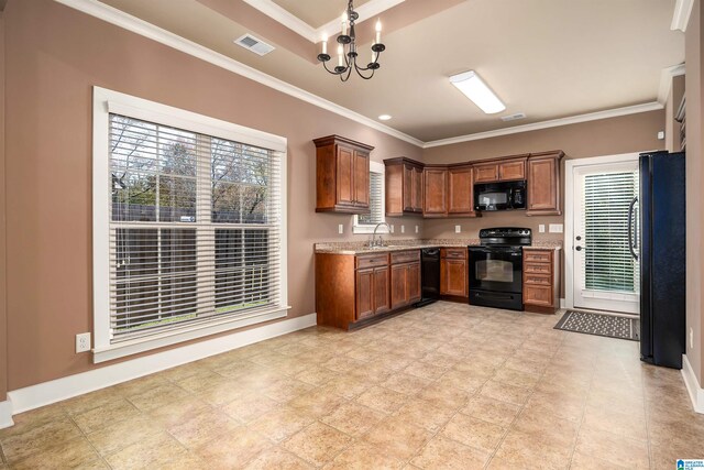 kitchen with black appliances, light stone counters, and crown molding