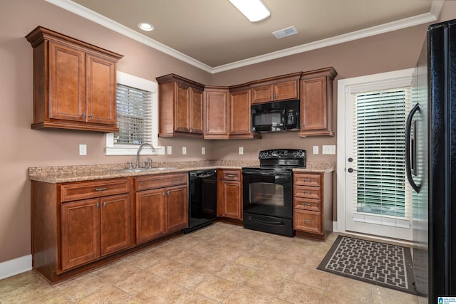 kitchen with light stone countertops, sink, black appliances, and ornamental molding