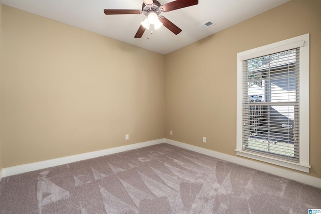 unfurnished room with ceiling fan and light colored carpet