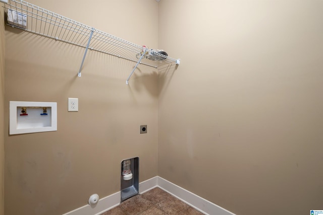 clothes washing area featuring hookup for an electric dryer, gas dryer hookup, and hookup for a washing machine