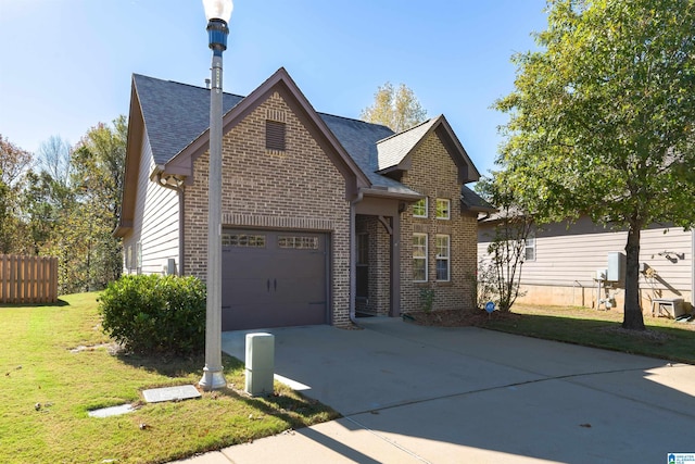 view of front facade with a garage and a front lawn