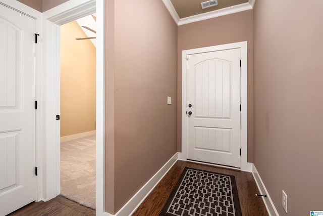 entryway featuring dark hardwood / wood-style floors and ornamental molding